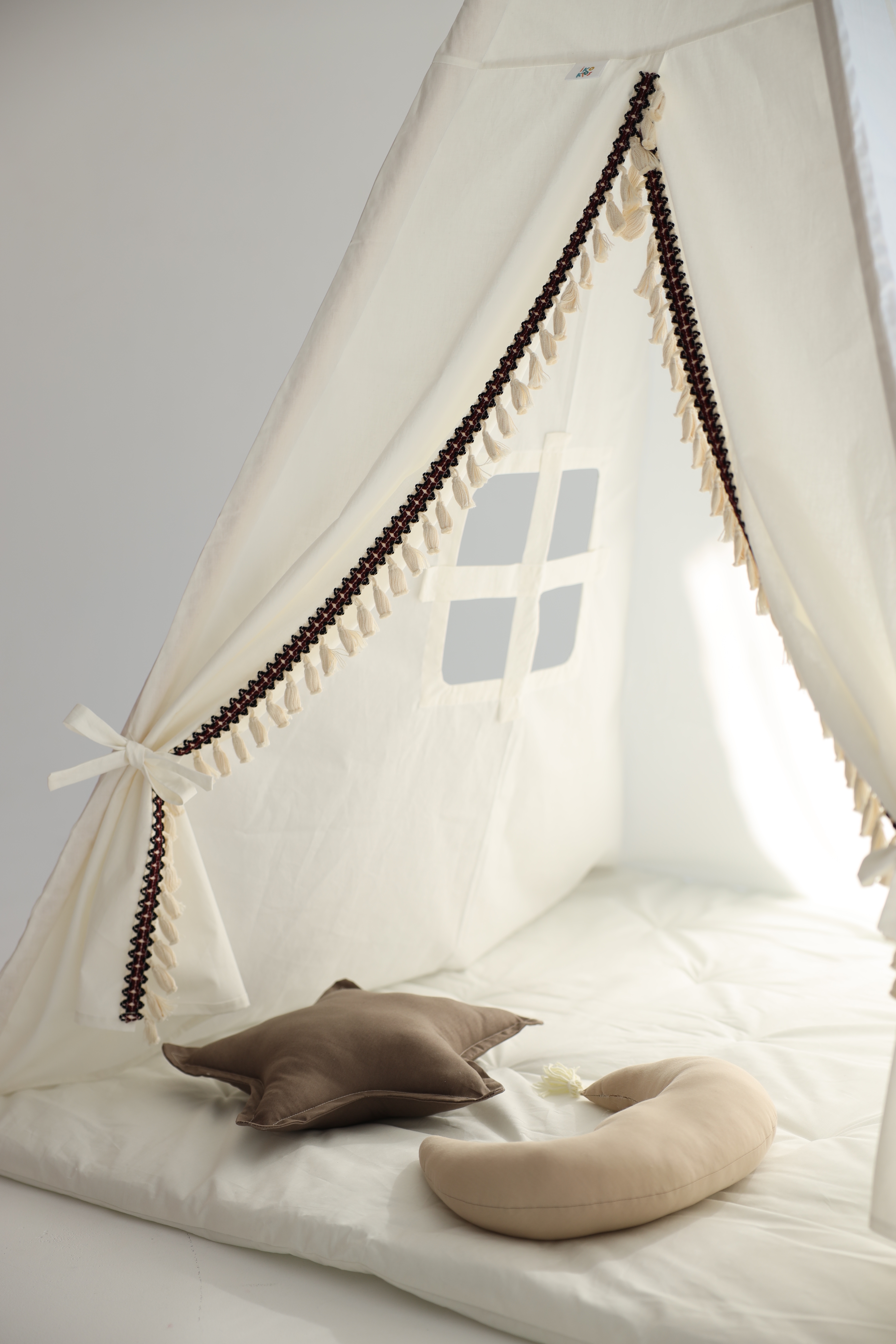 White/milky tent with moon and star cushions