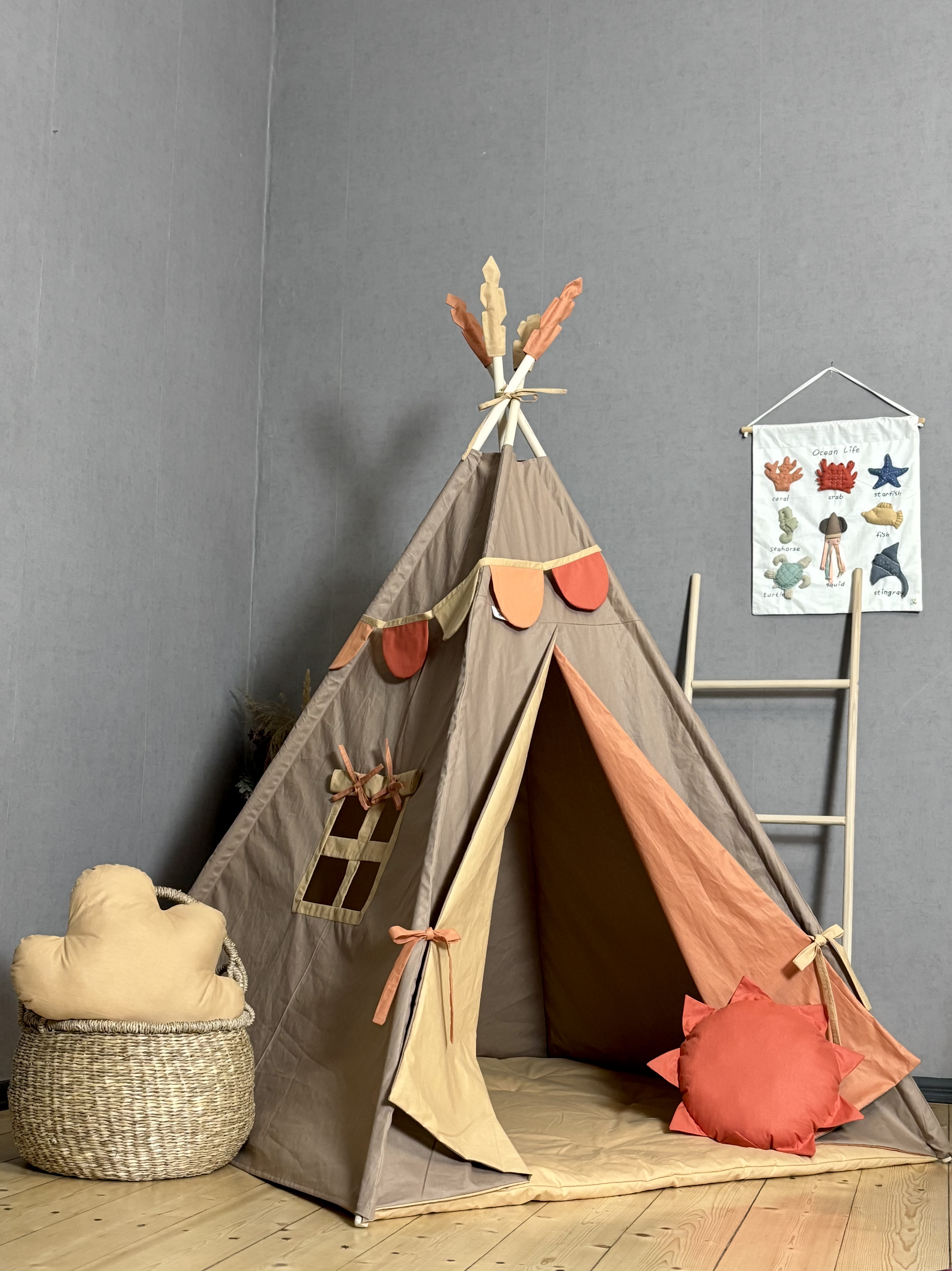 Light brown tent with a colorful entrance