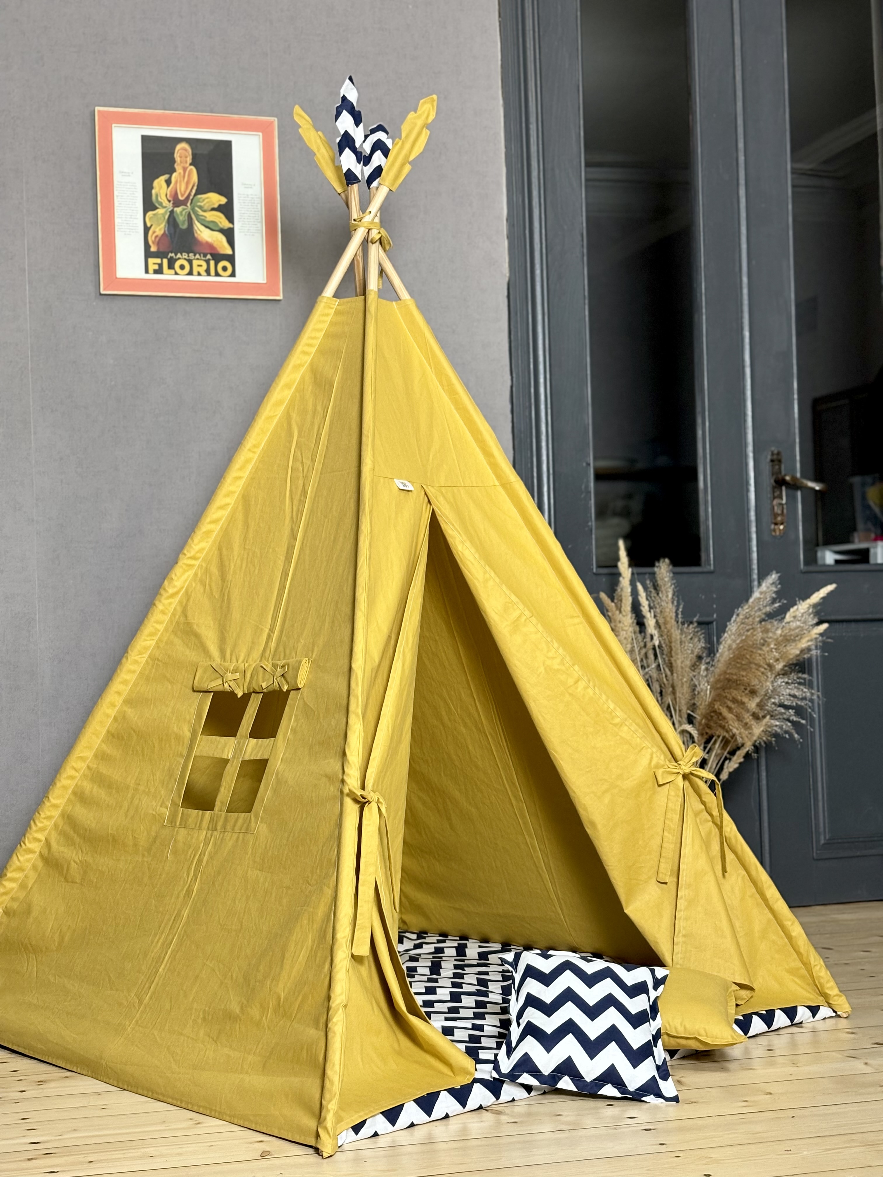 Yellow tent with blue zigzag lining