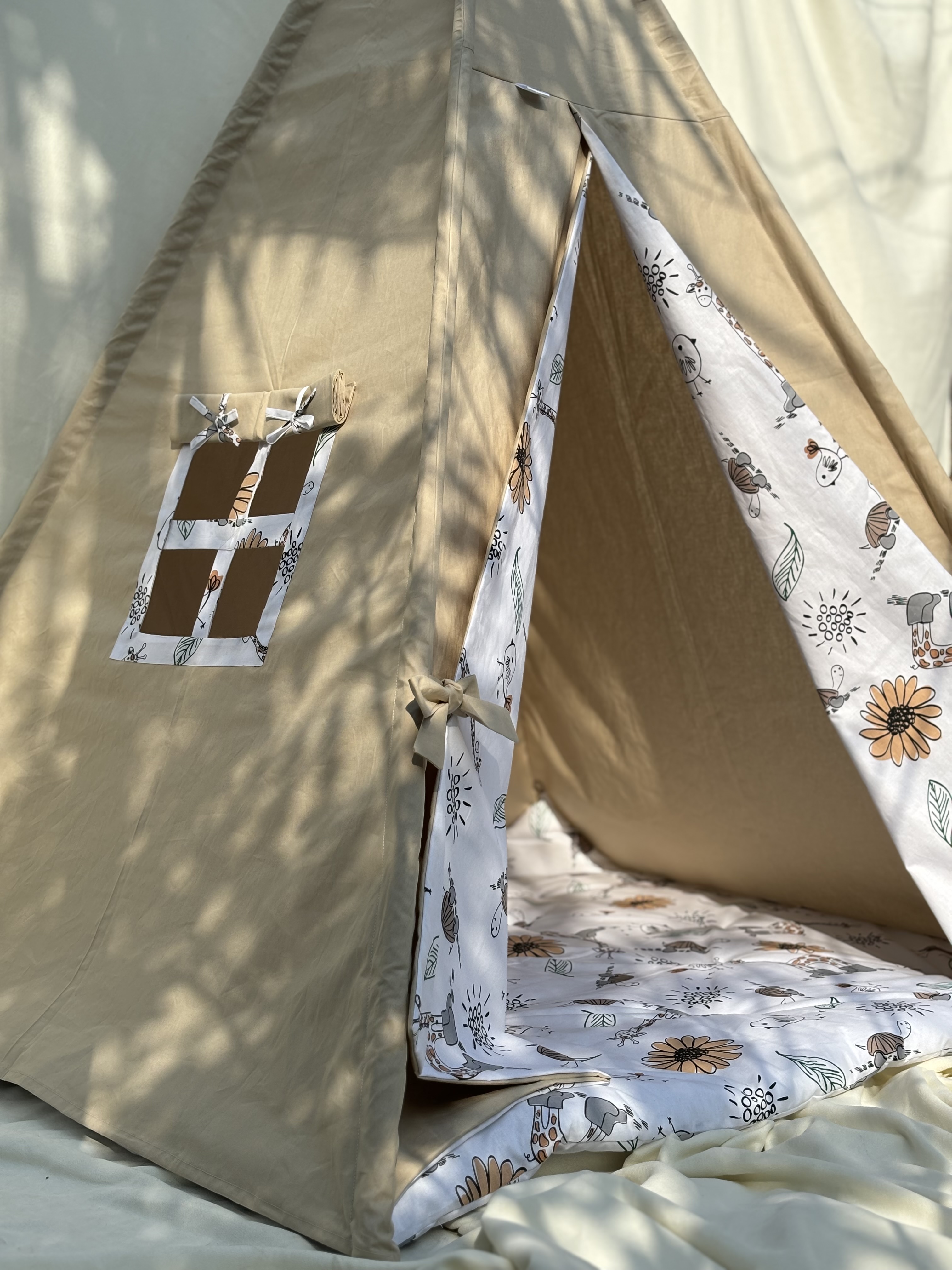 Beige tent with giraffe and floral print