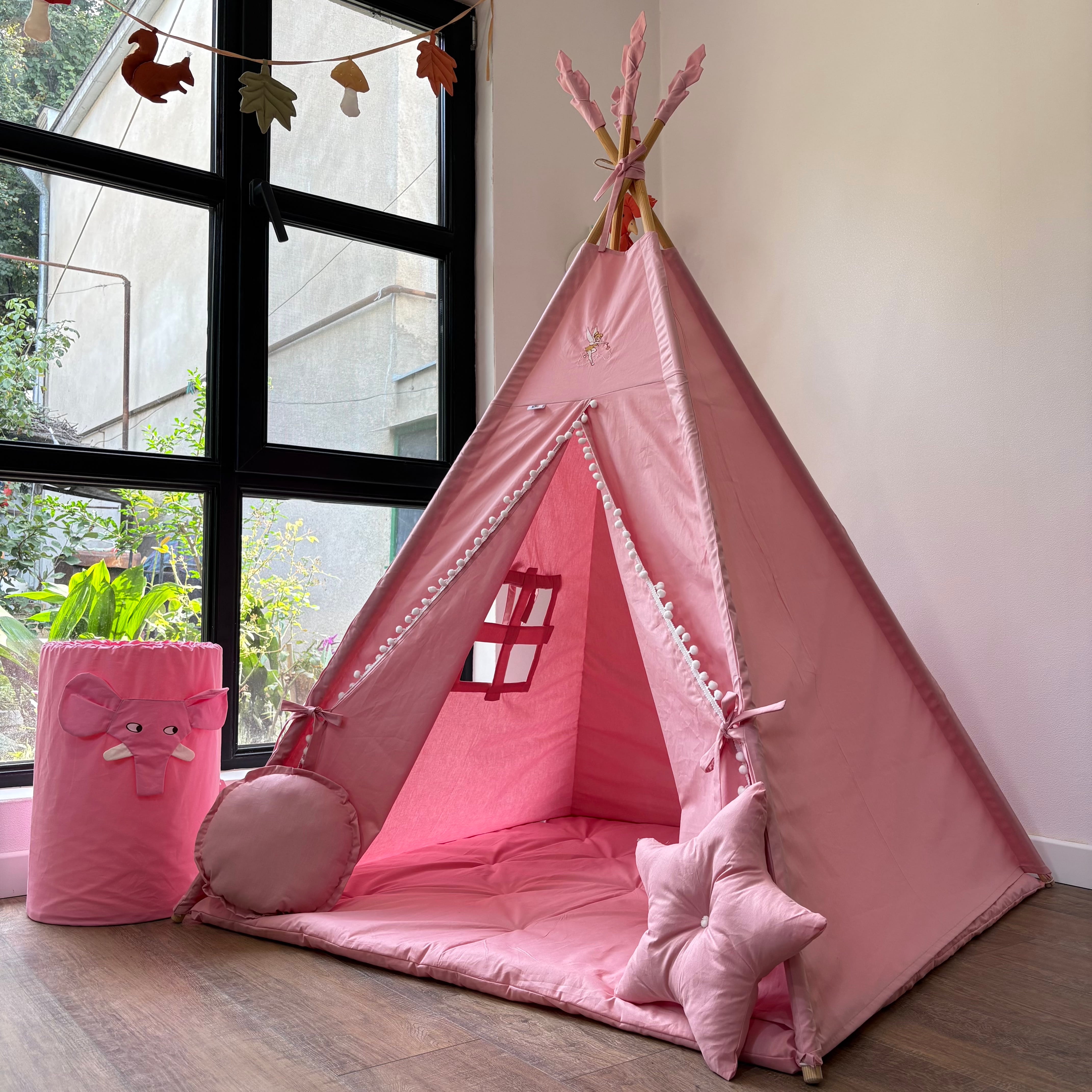 Pink tent with elephant embroidery on the top, including a storage compartment.