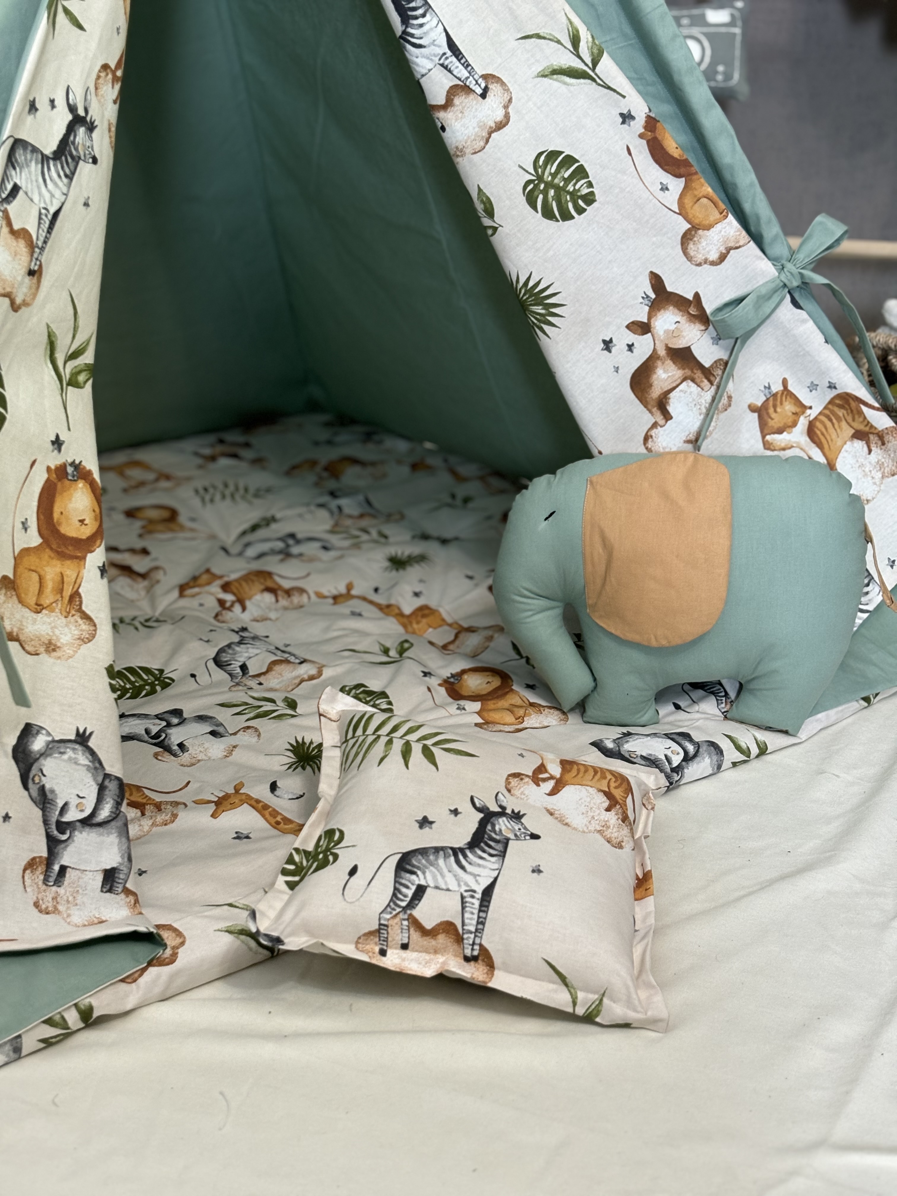 Green tent with animal print, Elephant and square pillows