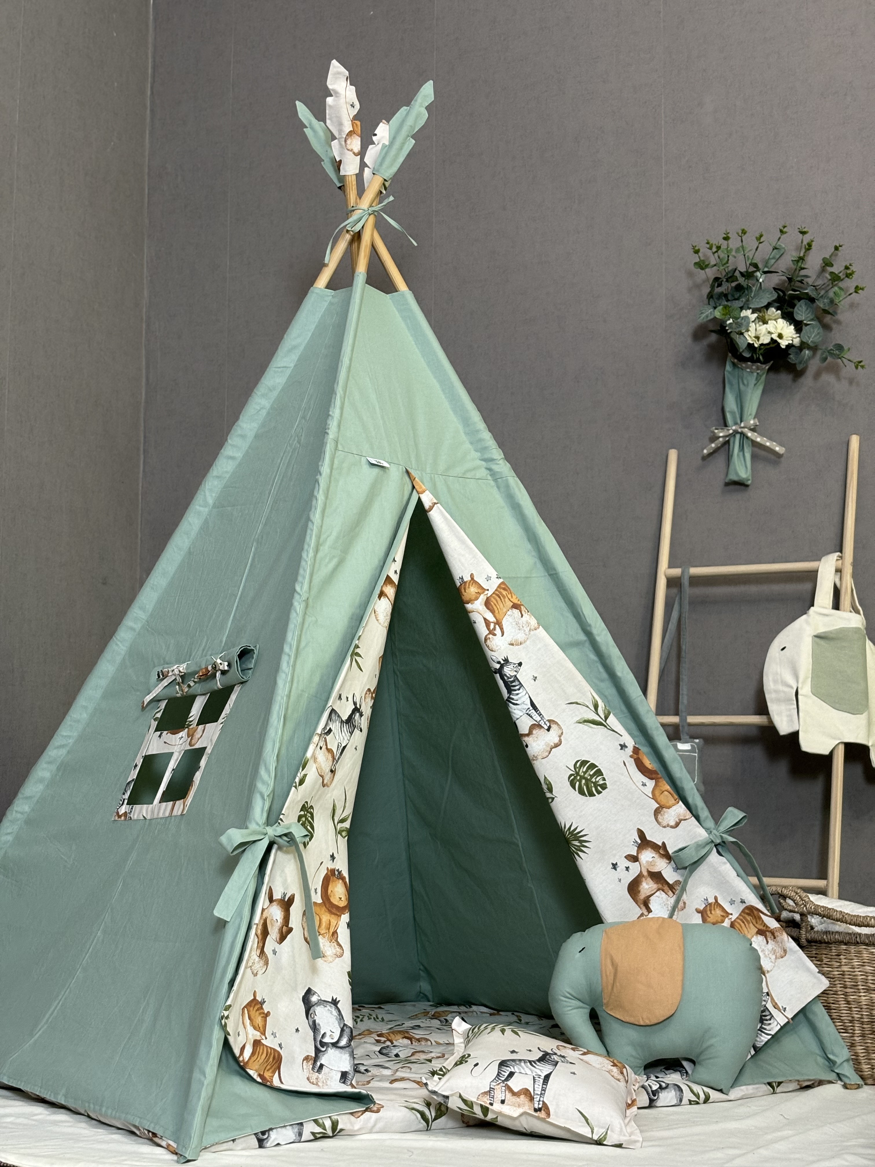 Green tent with animal print, Elephant and square pillows