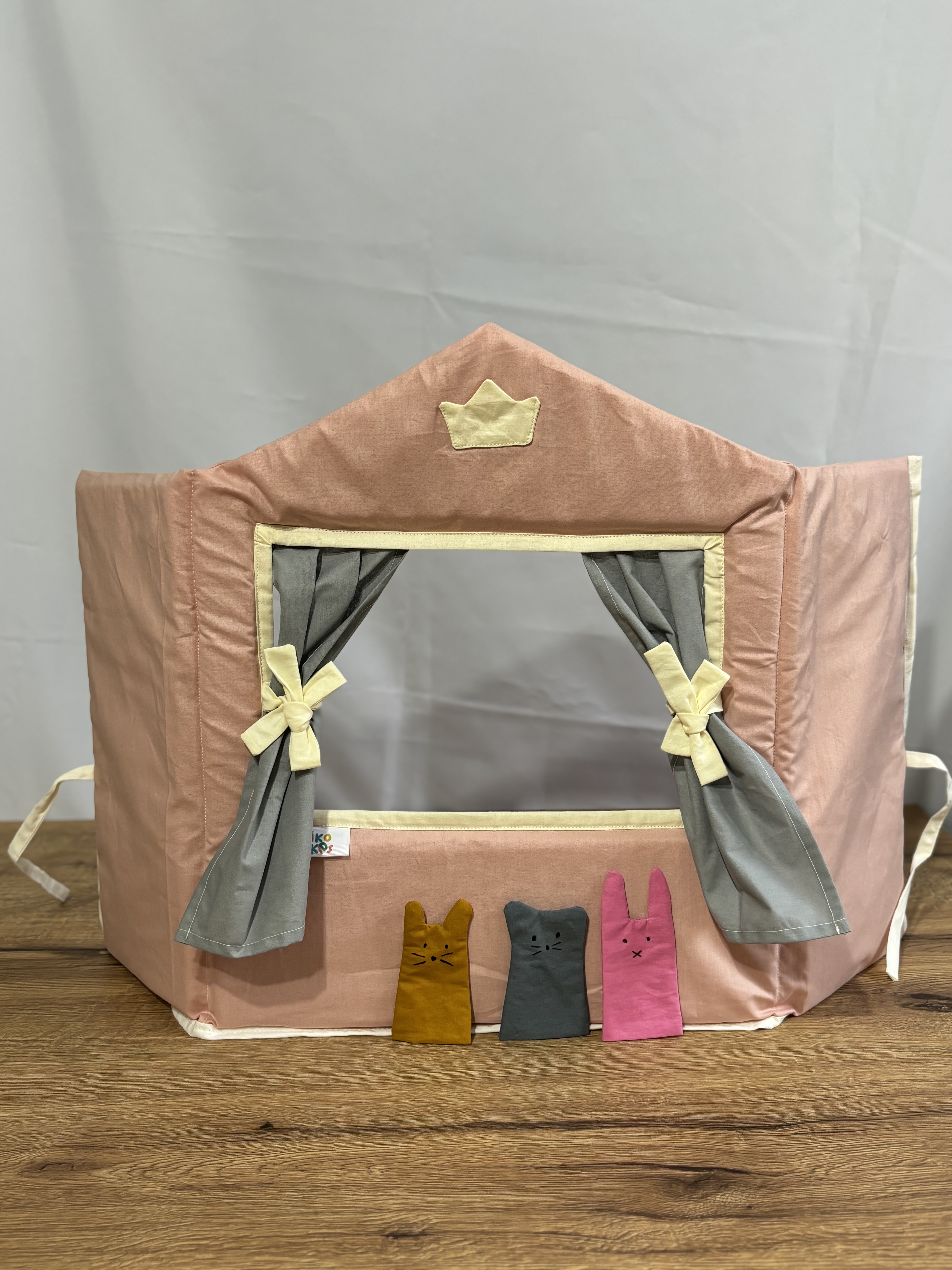 Pink  Puppet theater with gray curtains