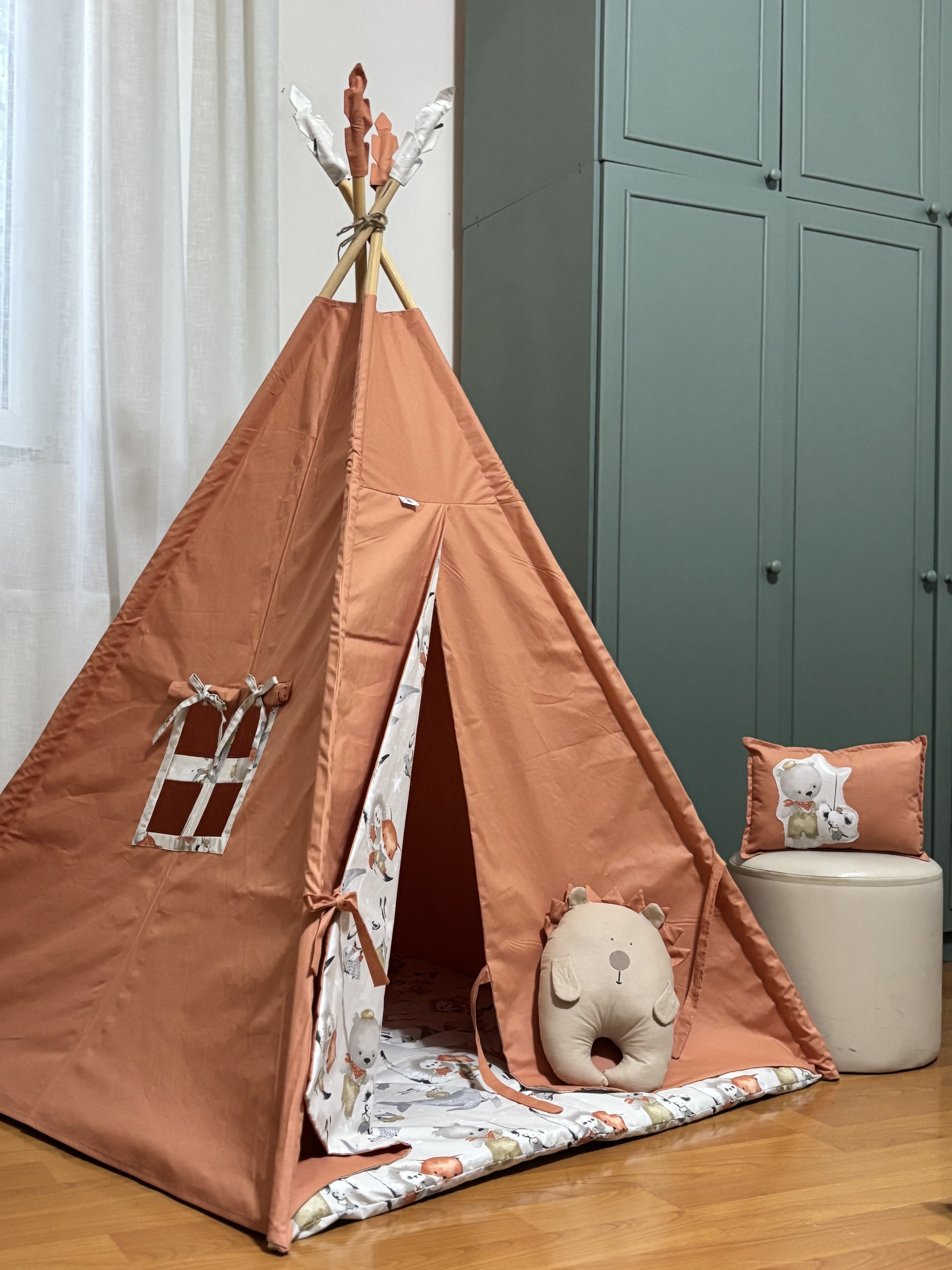 Brick-colored tent with a hedgehog and a rectangular cushion